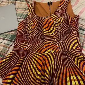 Multicolored pendulum shaped top